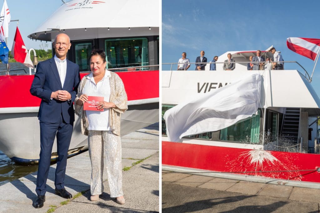 Dompfarrer Toni Faber und Schauspielerin Maria Happel posieren vor der MS Vienna bei dessen Schiffstaufe